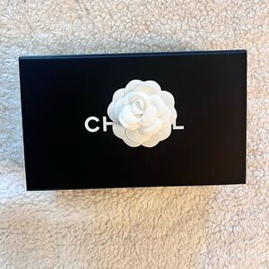 CHANEL Black Box with White Floral Accent